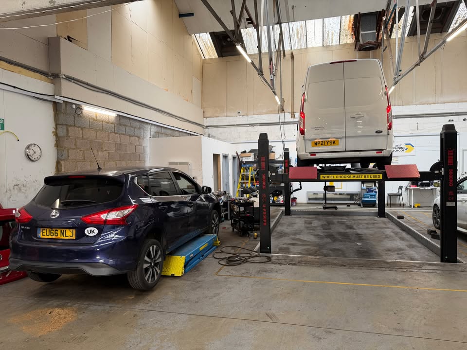 Van positioned on the MOT testing lift at Drive On Garage